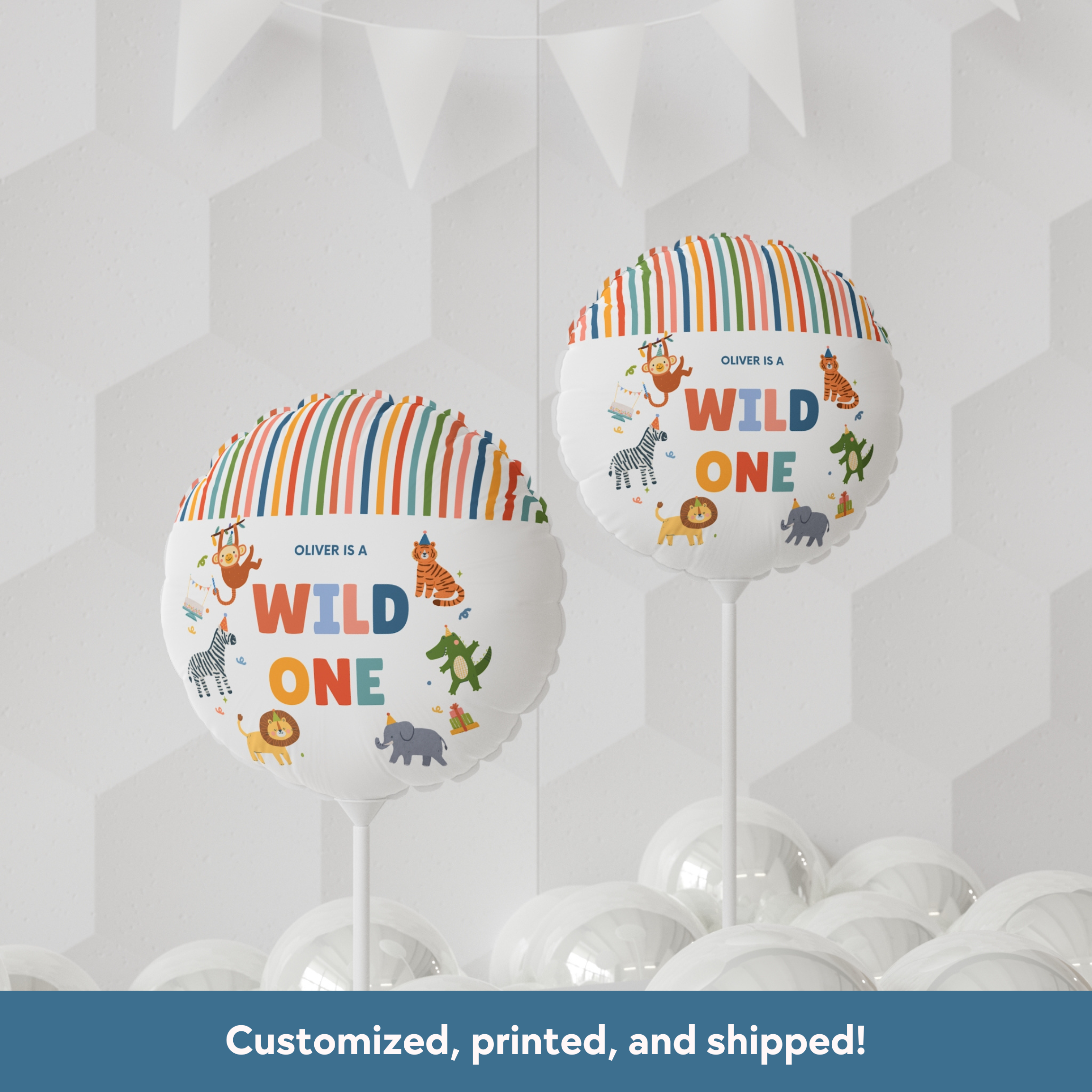 Two colorful balloons with 'Wild One' text and animal illustrations on a geometric patterned background.