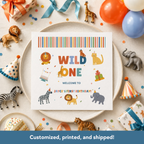 Birthday party setup with 'Wild One' sign and animal-themed decorations.