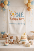 Birthday celebration with 'Happy Boy' banner, balloons, and teddy bears.