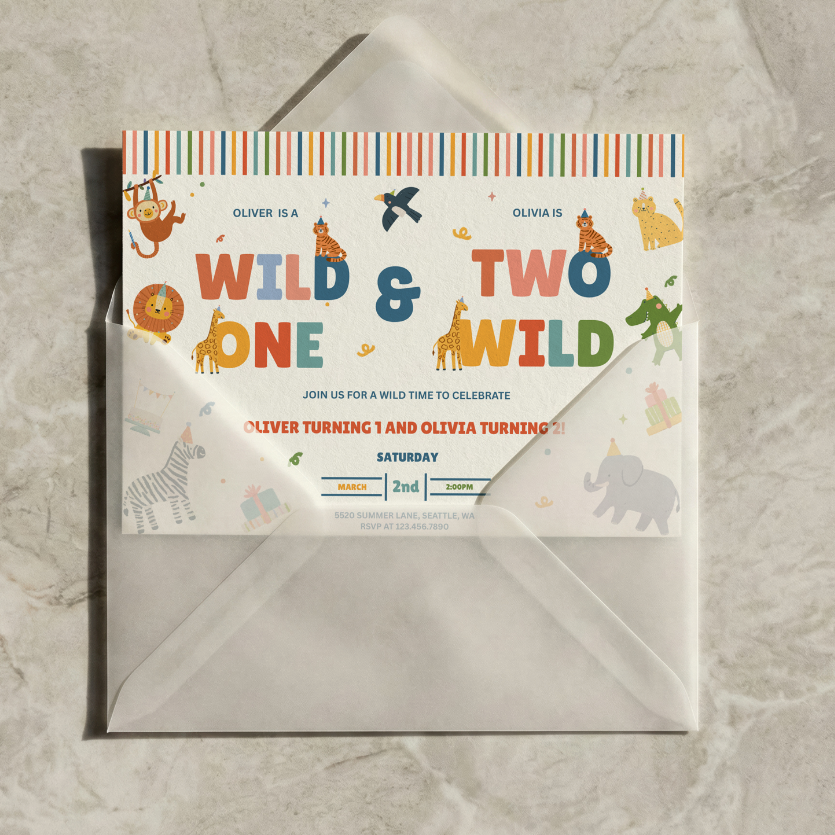 A children's birthday invitation card with an envelope, photographed from above on a light stone surface. The invitation features colorful safari animal illustrations and the text 'WILD & TWO WILD' with placeholder names and date details.