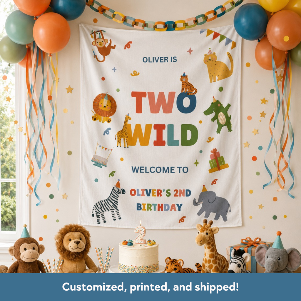 Birthday party setup with a banner reading 'Oliver is Two Wild, Welcome to Oliver's 2nd Birthday' surrounded by balloons and toys.