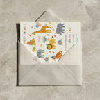 Children's birthday party invitation with animal illustrations on a gray envelope.