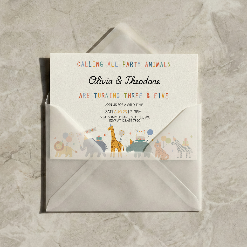 Invitation card with animal illustrations on a gray envelope against a marble background