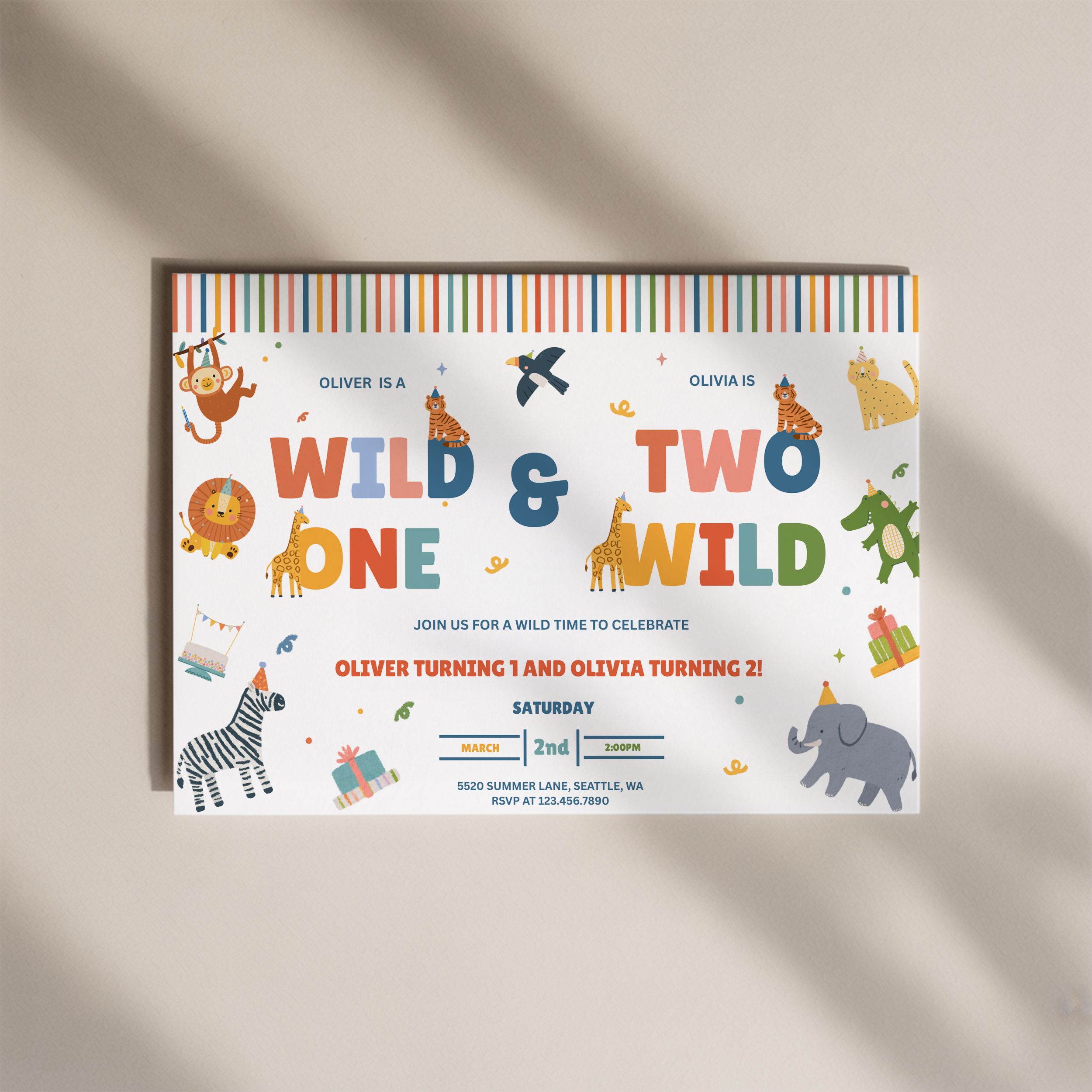 A colorful children's birthday invitation card featuring safari animal illustrations and the text 'WILD & TWO WILD ONE' on a white background, photographed on a warm beige surface with soft diagonal shadows.