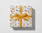 Gift box with animal pattern and yellow ribbon on a white background