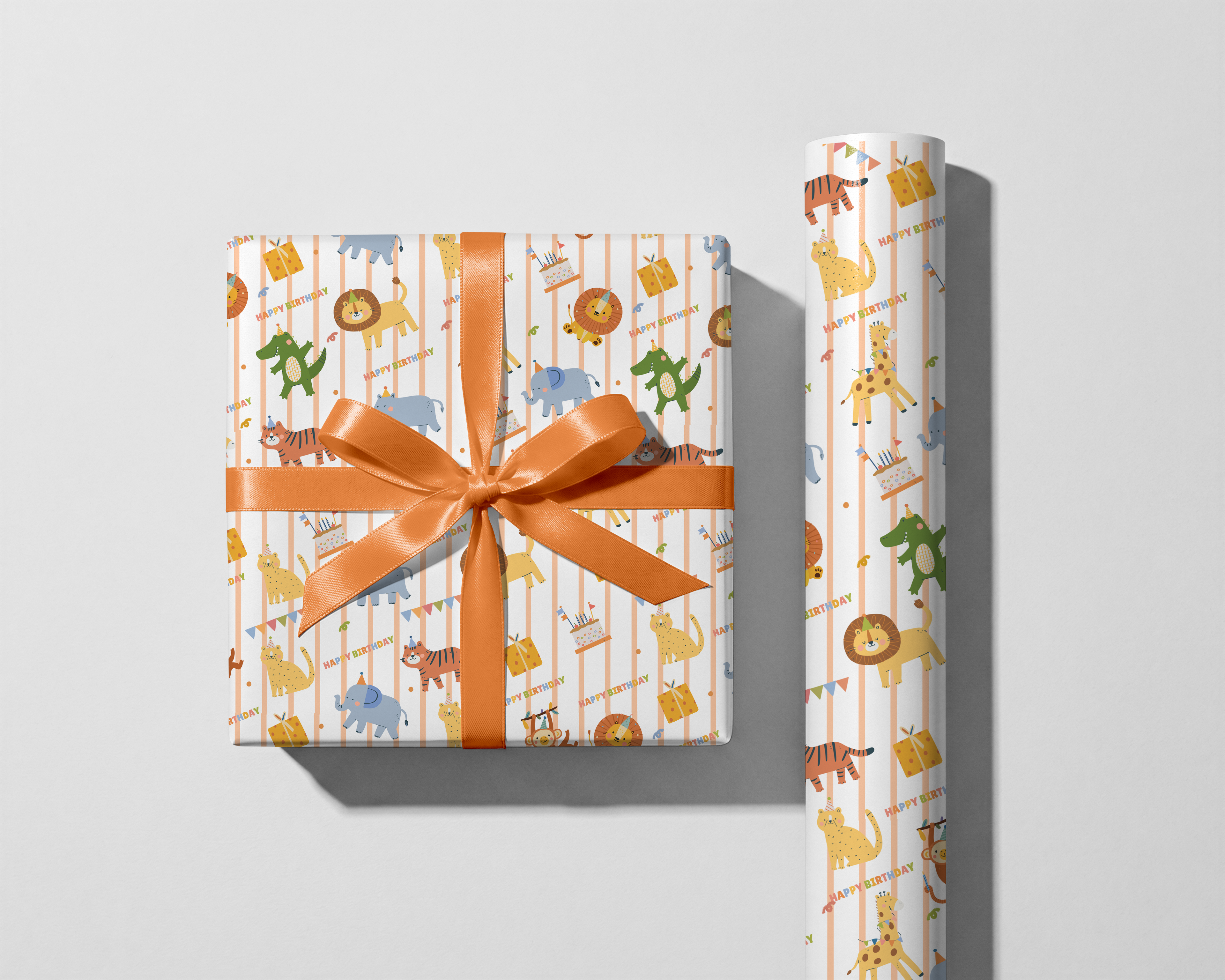 Gift wrap with animal pattern and orange ribbon on a light gray background